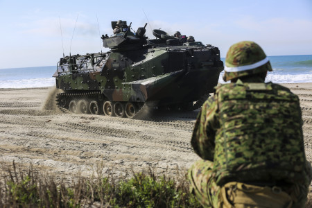 A Japan Ground Self-Defense Force solider provides security as an amphibious assault vehicle moves to a viable position to provide perimeter security during a scenario based, battalion-sized amphibious landing exercise (PHIBLEX) for Exercise Iron Fist 2016, Feb. 26, 2016. Capable maritime forces help ensure stability and prosperity around the world, and bilateral exercises, like Iron Fist, help partner nations improve their own maritime capability. (U.S. Marine Corps photo by Cpl. April L. Price/Released)