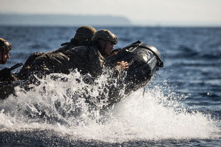 U.S. Marines with 3rd Reconnaissance Battalion, 3rd Marine Division, conduct combat rubber raiding craft training on Camp Schwab, Okinawa, Japan, July 16, 2019. While operating a CRRC, Marines maneuvered several miles into the ocean and ran drills by embarking and disembarking from the U.S.S. Germantown (LSD-42). Working with their Navy counterparts improves efficiency, interoperability and combat readiness. (U.S. Marine Corps photo by Cpl. Josue Marquez)